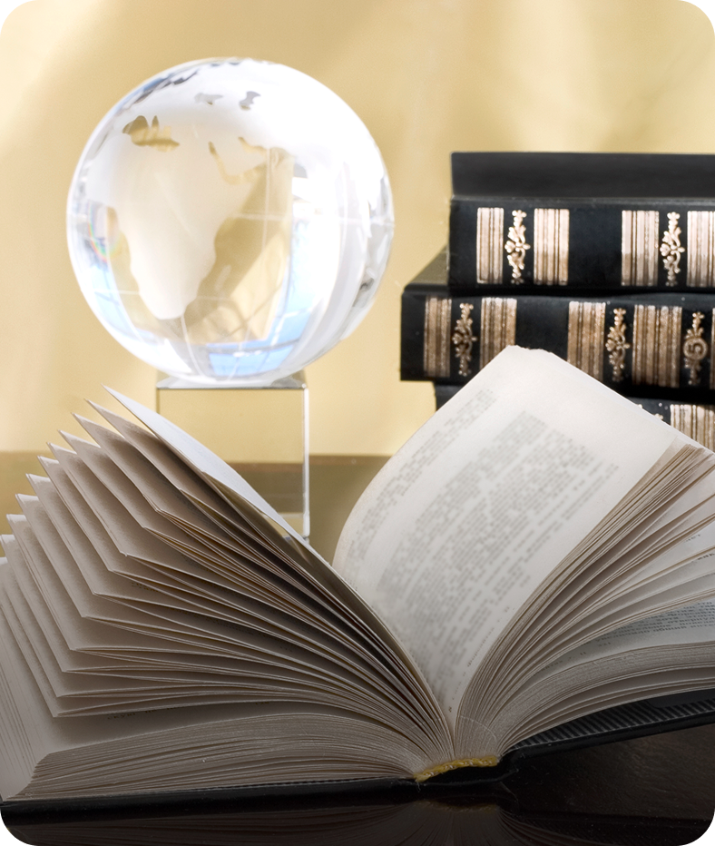 Open book, globe, and stacked books.